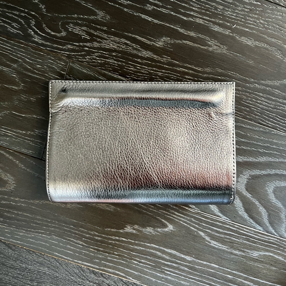 Ximena Kavalekas gold clutch